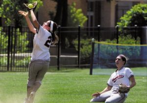 A girls 16-inch softball team plays with glove during national high school tournament. 