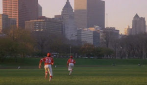 A 16 inch softball varsity high school team plays a game in Grant Park.
